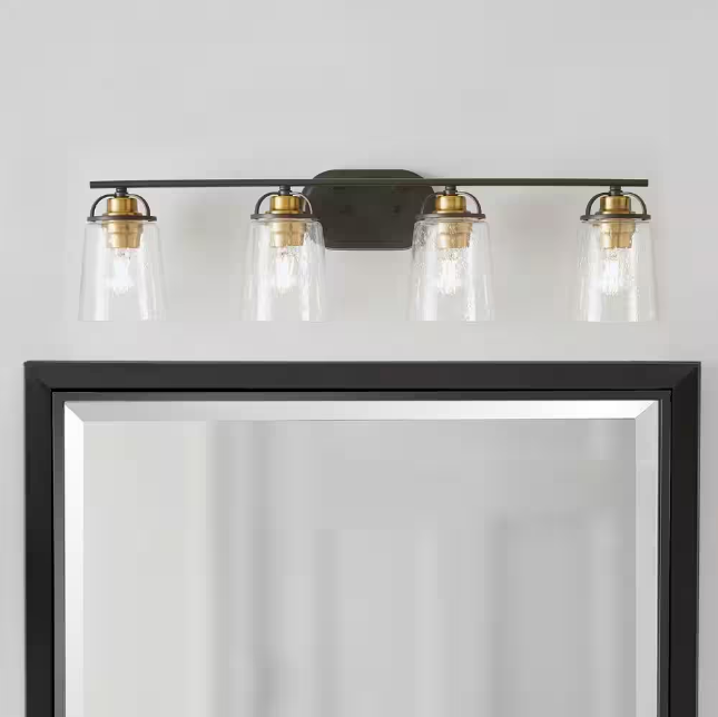 Goddard 33.18 in. 4-Light Bronze Industrial Bathroom Vanity Light with Vintage Brass Accents and Clear Seeded Glass